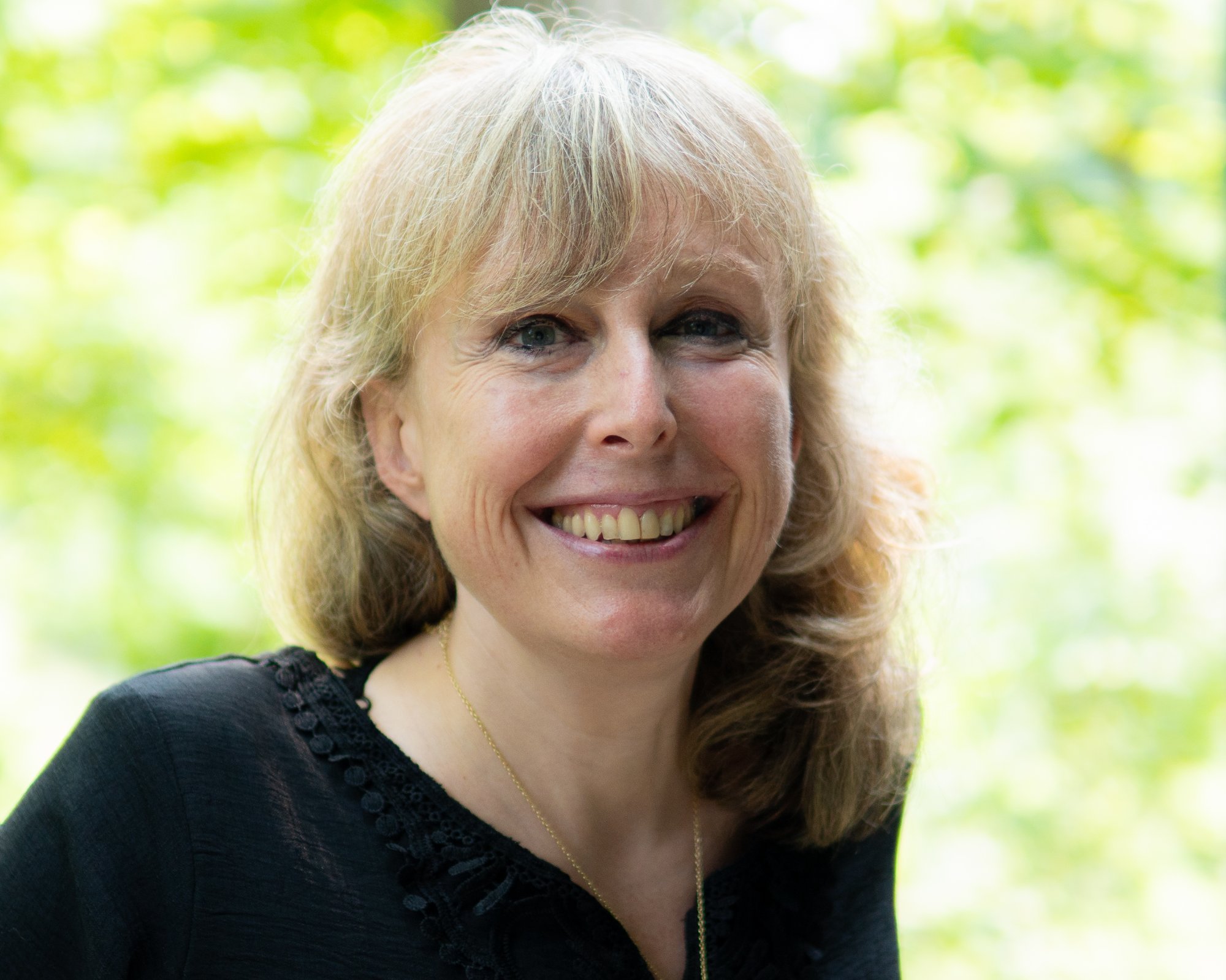 Portrait - tight headshot in natural setting