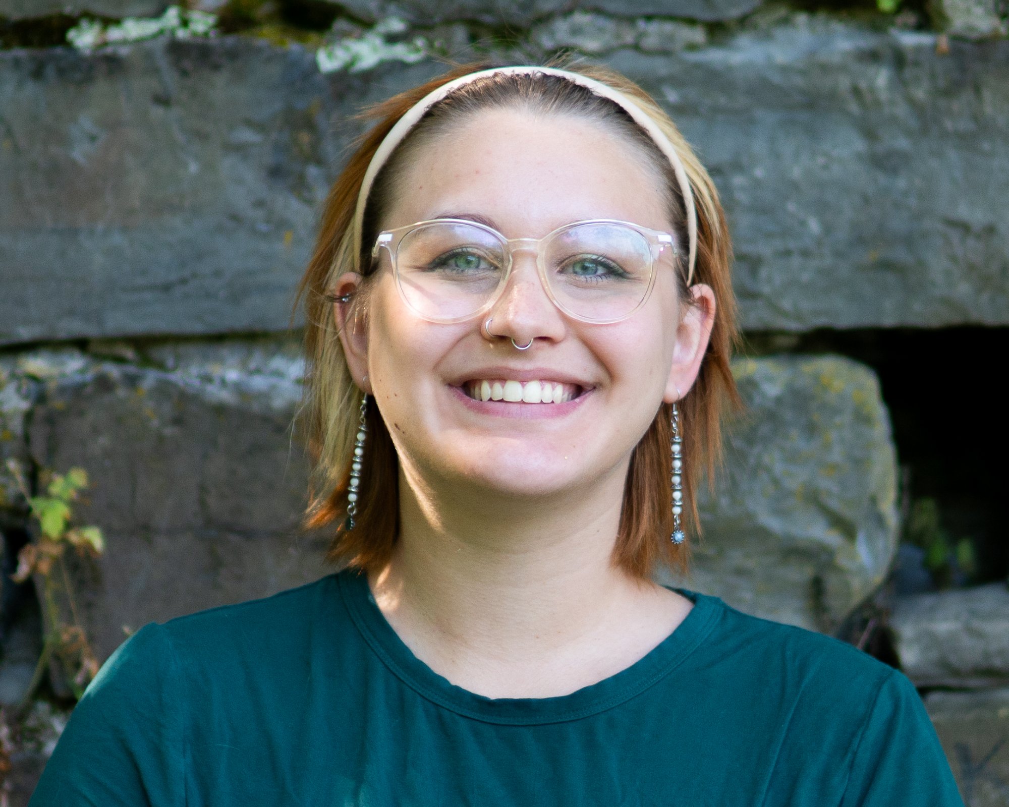 Portrait - outdoor headshot with stone backdrop